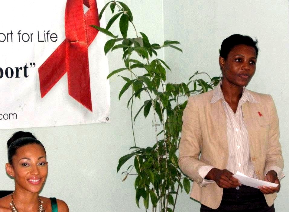 Kadine Reynolds speaking at a community advocacy event in Jamaica