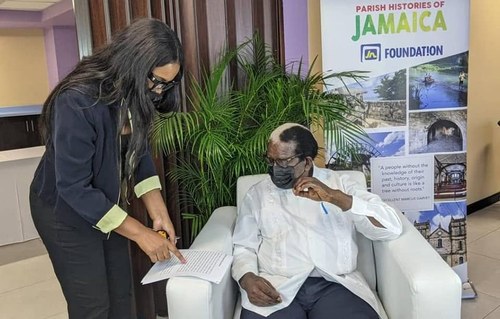 Kadine Reynolds reviewing a document during a working session